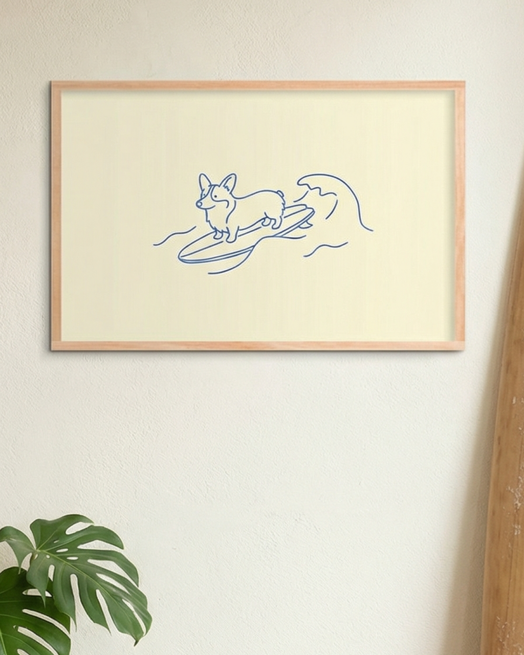 Framed artwork of a dog surfing on a wave with a plant and wooden object in the foreground.
